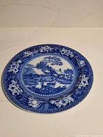 Cottage scene plate front view, showing landscape and border