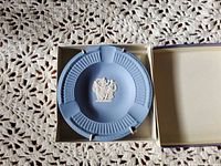Ashtray in box showing fluted rim and white relief