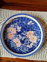 Front view of porcelain charger showing full design
