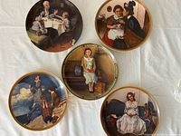 Group shot of all five Norman Rockwell plates