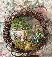 Full view of grapevine wreath showing complete woodland scene