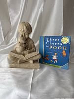 Figurine and book front view