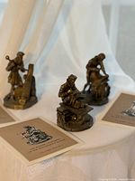 All three figurines with collector cards