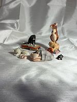 Group shot of all six figurines arranged together
