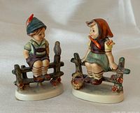 Front view of both figurines showing design and details