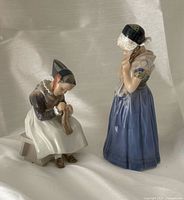 Front view of both Royal Copenhagen Dutch girl figurines