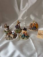 Group shot of all five figurines and display card
