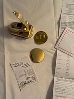 Embosser, two foil seals, instruction booklet, order forms overview