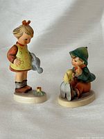 Front view of both figurines