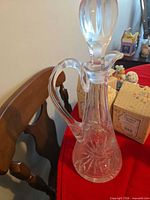 Full view of decanter with stopper inserted showing starburst cuts