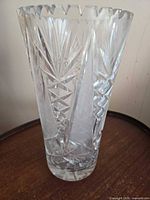 Full view of clear cut crystal vase showing height and pattern