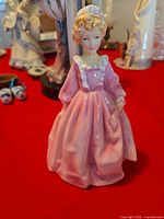 Front view of porcelain figurine in pink gown