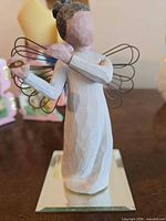 Full view of Angel of Harmony figurine on mirrored base