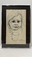 Frontal view of framed ink drawing showing artwork, mat, and frame