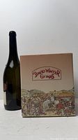 Box front with David Winter Cottages branding beside scale bottle