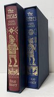 Spines of both books inside their slipcases