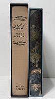 Spines of both books inside slipcases