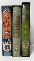 Spines of the three clothbound volumes inside slipcases