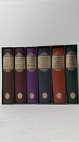 Six volumes in slipcases showing spines with gilt labels
