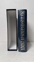 Spine view showing title gilt lettering next to empty slipcase