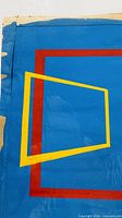 overall view showing blue field, red border, yellow shape, tape edges