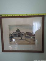 Full view of framed print with measuring tape showing width under 24 in
