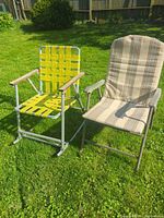 Both folding chairs side by side on lawn