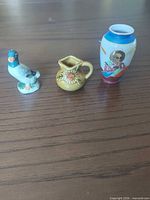 Group shot of bird figurine, sunflower pitcher, Japanese style vase