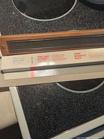 Zwilling packaging beside wood magnetic rack