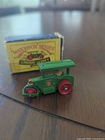 Road roller front left with box behind