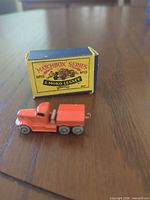 Die-cast truck positioned in front of original Matchbox Series No.15 box