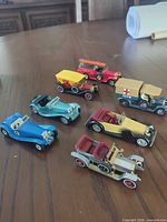 Overall group of seven vintage Matchbox diecast cars on table