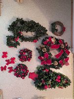 Overview of wreaths, garland, bows and tabletop arrangement