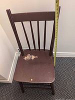 Full view of brown spindle-back chair