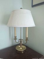 Full view of lamp with shade showing two candlestick arms and base