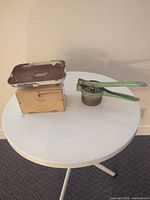 Scale and citrus press on table
