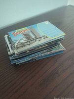 Stack of vintage postcards, top card Toronto city view