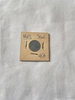 Front of 1943 steel penny in cardboard flip