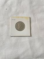 Obverse of 1972 Canadian 25-cent coin in holder showing Queen Elizabeth II