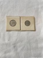 Both 1979 Jefferson nickels in their flips side by side