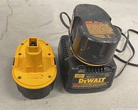 Battery charger and one battery side by side