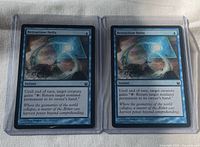 Front view of both Retraction Helix cards in sleeves