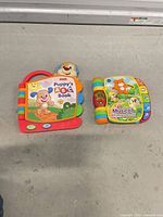 Both interactive toddler books side by side