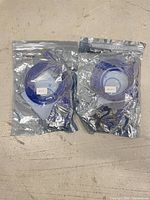 Both sealed diagnostic cables side by side in foil pouches
