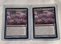 Front view of both Whip of Erebos cards in top loaders