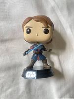 Front view of Anakin Skywalker Funko Pop on stand