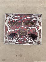 Outer box top showing Game of Thrones House Stark graphics