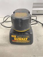 Front view of DeWalt charger with battery seated