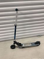 Full side view of folded-ready kick scooter showing overall condition