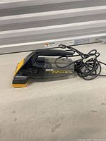 Side view of Hoover Brush Vac with cord visible